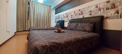 a bedroom with a bed with a stuffed animal on it at Fahrenheit 88, Kuala Lumpur 11 in Kuala Lumpur