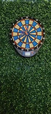 a dart board sitting on top of green grass at Fahrenheit 88, Kuala Lumpur 11 in Kuala Lumpur