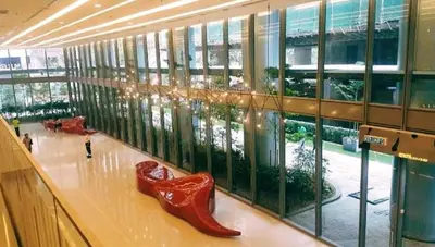 a large building with two red shoes on the floor at Mercu Summer Suites KLCC by Star Residence in Kuala Lumpur