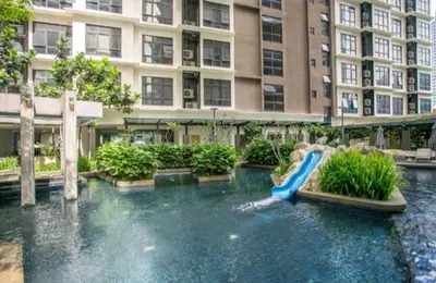 a water slide in the middle of a building at 188 Suites KLCC by Signature Apartment in Kuala Lumpur