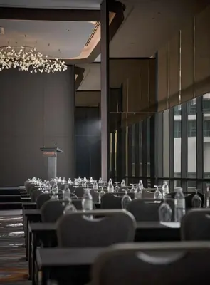 a row of chairs in a large room with a chandelier at Amari Kuala Lumpur in Kuala Lumpur