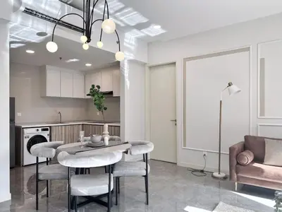 a kitchen and dining room with a table and chairs at The Ooak Suites and Residence@ Kiara 163 in Kuala Lumpur