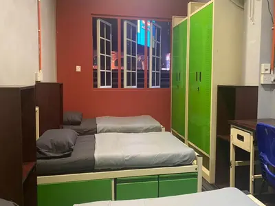 a room with two beds with green and red walls at RHV Bukit Bintang , Kuala Lumpur in Kuala Lumpur
