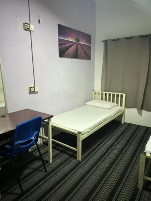 a room with a bed and a table and a desk at RHV Bukit Bintang , Kuala Lumpur in Kuala Lumpur
