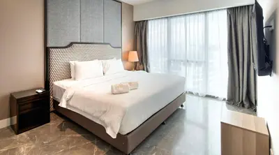 a bedroom with a large bed and a large window at Platinum 2 by DM Suites KLCC , Kuala Lumpur in Kuala Lumpur