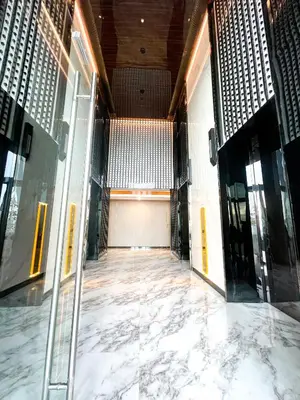 an empty lobby with glass doors and marble floors at Platinum 2 by DM Suites KLCC , Kuala Lumpur in Kuala Lumpur