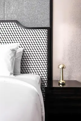 a bedroom with a bed with a black and white headboard at Platinum 2 by DM Suites KLCC , Kuala Lumpur in Kuala Lumpur