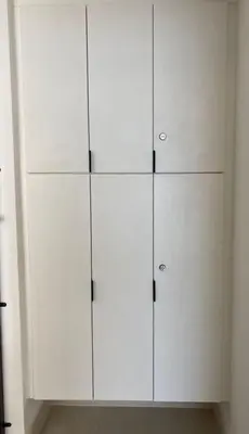 a white cabinet with four doors in a room at Lovely Continew Residence 2 Bedrooms - KL in Kuala Lumpur