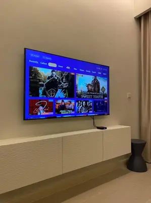 a large flat screen tv on a wall at Lovely Continew Residence 2 Bedrooms - KL in Kuala Lumpur