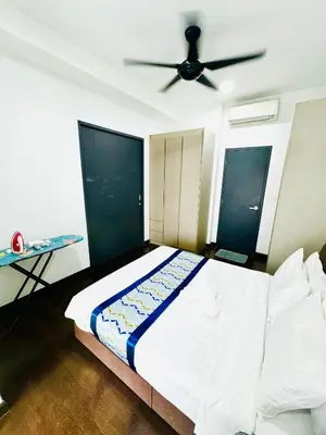 a bedroom with a bed with a ceiling fan at Velocity Residence at Sunway mall in Kuala Lumpur