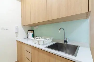 a kitchen with a sink and a counter top at Colony @ Kampung Baru by Plush in Kuala Lumpur