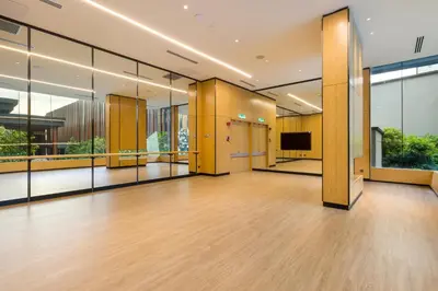 an empty lobby with wooden floors and large windows at M Resort & Hotel Kuala Lumpur in Kuala Lumpur