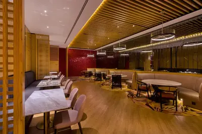 a restaurant with tables and chairs in a room at M Resort & Hotel Kuala Lumpur in Kuala Lumpur