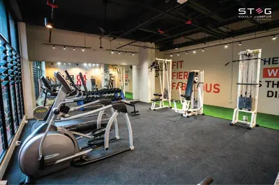 a gym with several treadmills and cardio machines at STEG Kuala Lumpur in Kuala Lumpur