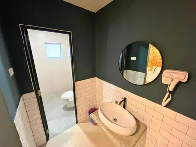 a bathroom with a sink and a mirror at Smile Hotel Titiwangsa Pekeliling Sentul in Kuala Lumpur