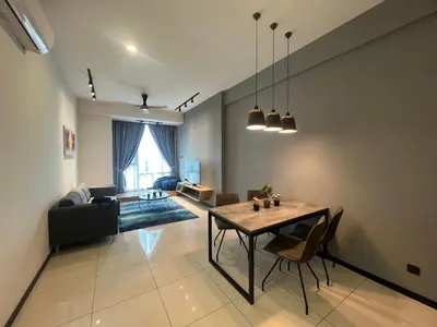 a living room with a table and a couch at Opus Residences Merdeka Tower 118 View in Kuala Lumpur