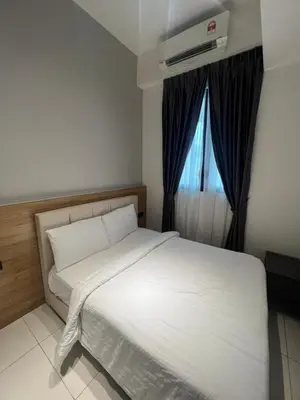 a bedroom with a white bed and a window at Opus Residences Merdeka Tower 118 View in Kuala Lumpur