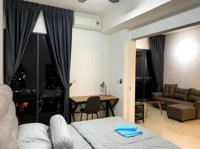 a bedroom with a bed and a couch and a table at Lucky Continew Residence 1 Bedroom - TRX KL in Kuala Lumpur