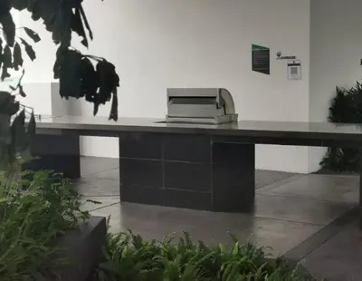 a printer sitting on a desk in a building at Lucky Continew Residence 1 Bedroom - TRX KL in Kuala Lumpur