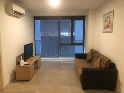 a living room with a couch and a television at Gorgeous Fairlane 2 Bedrooms - Bukit Bintang KL in Kuala Lumpur