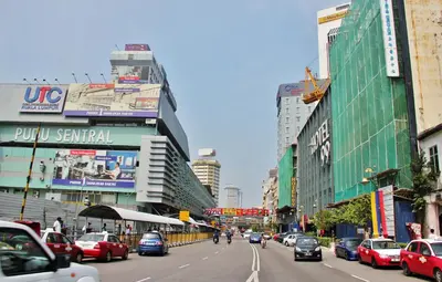 a busy city street filled with cars and buildings at Hotel 99 Kuala Lumpur City in Kuala Lumpur