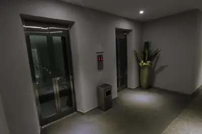 an empty room with a vase with flowers in it at Hotel 99 Kuala Lumpur City in Kuala Lumpur