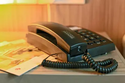 a telephone sitting on top of a desk at Hotel 99 Kuala Lumpur City in Kuala Lumpur