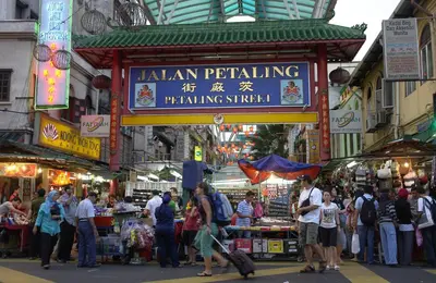 a crowd of people walking around a market in a city at Hotel 99 Kuala Lumpur City in Kuala Lumpur
