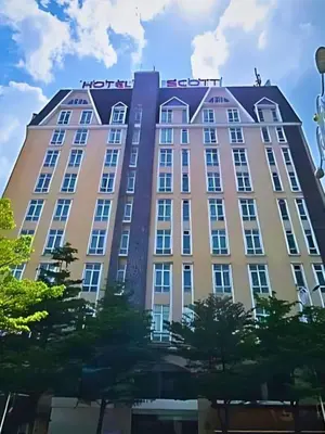 a large building with a sign on top of it at Palette KL Sentral Station Formerly Scott Hotel in Kuala Lumpur