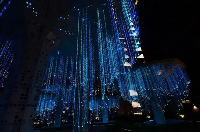 a bunch of blue lights hanging from a building at Stylish & Cozy 2BR Apt at Arte Plus, FREE Parking in Kuala Lumpur