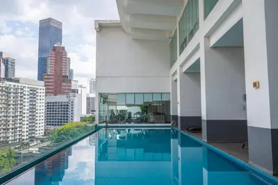 a swimming pool on the roof of a building at Lila Suites One Bukit Ceylon in Kuala Lumpur