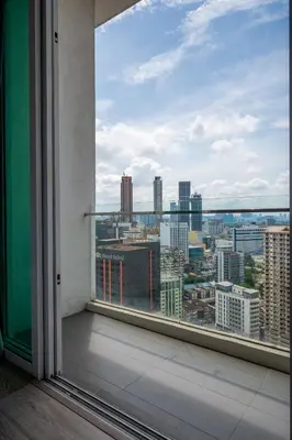 a view of a city from a window at Lila Suites One Bukit Ceylon in Kuala Lumpur