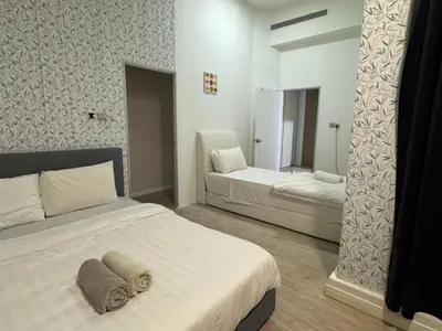 a bedroom with a bed and a mirror in it at Mcity at Jalan Ampang in Kuala Lumpur