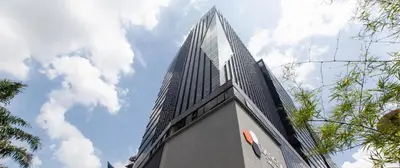 a tall building with a sky in the background at The Infinite - Bangsar Trade Centre in Kuala Lumpur