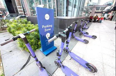 a row of electric scooters parked on a sidewalk at Fahrenheit88-Korea Theme Bukit Bintang Kuala Lumpur 2R2B 6Pax in Kuala Lumpur