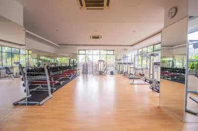 a gym with lots of treadmills and machines at Peaceful 3-bedroom with Pool 5 pax - Wangsa Maju in Kuala Lumpur