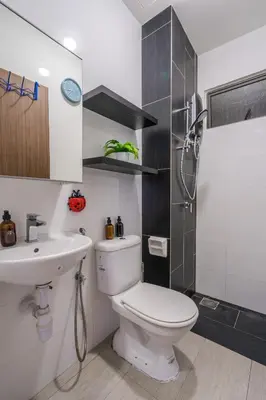 a bathroom with a toilet and a sink and a shower at Peaceful 3-bedroom with Pool 5 pax - Wangsa Maju in Kuala Lumpur