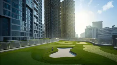 a golf course in the middle of a city with tall buildings at Robertson Suites Bukit Bintang with Netflix in Kuala Lumpur
