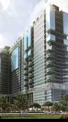 a tall glass building with trees in front of it at Flexi check in 10min to KLCC next to Hospital Gleneagle in Kuala Lumpur