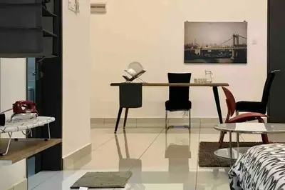 a room with a table and chairs in a room at Flexi check in 10min to KLCC next to Hospital Gleneagle in Kuala Lumpur