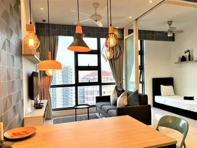 a living room with a couch and a bed at Eclipse Suites Robertson Bukit Bintang in Kuala Lumpur
