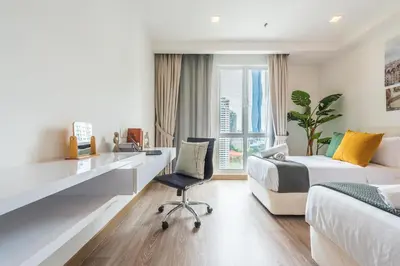 a bedroom with a desk and a bed and a chair at 2BR Tourists-Friendly Oasis - Heart of the City KL by Verano in Kuala Lumpur