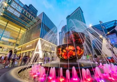 a water fountain in front of some buildings at Starlight Penthouse 6-12Pax, 600m to Pavilion KL by Verano in Kuala Lumpur