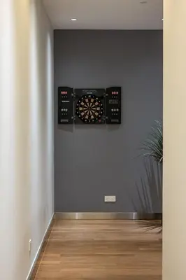 a room with a dart board on the wall at Starlight Penthouse 6-12Pax, 600m to Pavilion KL by Verano in Kuala Lumpur