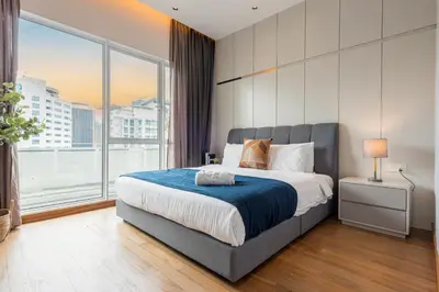 a bedroom with a large bed and a large window at Starlight Penthouse 6-12Pax, 600m to Pavilion KL by Verano in Kuala Lumpur