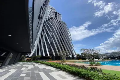 a tall building with a swimming pool in front of it at Urban Duplex v Balcony- 2R2B Up to 7Pax, MontKiara by Verano in Kuala Lumpur