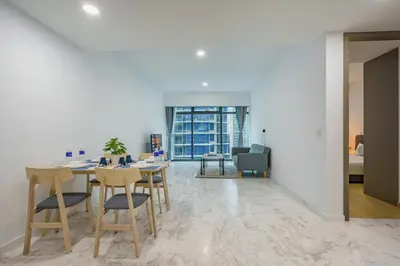 a dining room with a table and chairs at Eaton Residence KLCC in Kuala Lumpur