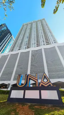 a large building with a mlb sign in front of it at UNA Serviced Apartment by manatidur in Kuala Lumpur