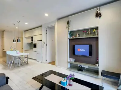 a living room with a television on a wall at The Platinum KLCC By Crystal in Kuala Lumpur
