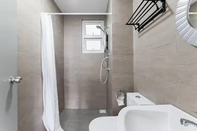 a bathroom with a shower and a toilet and a sink at TR Residence Lovely 3 BR unit 6pax next to Titiwangsa LRT in Kuala Lumpur